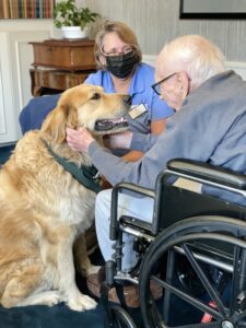 Buddy greets a patient at Mission House