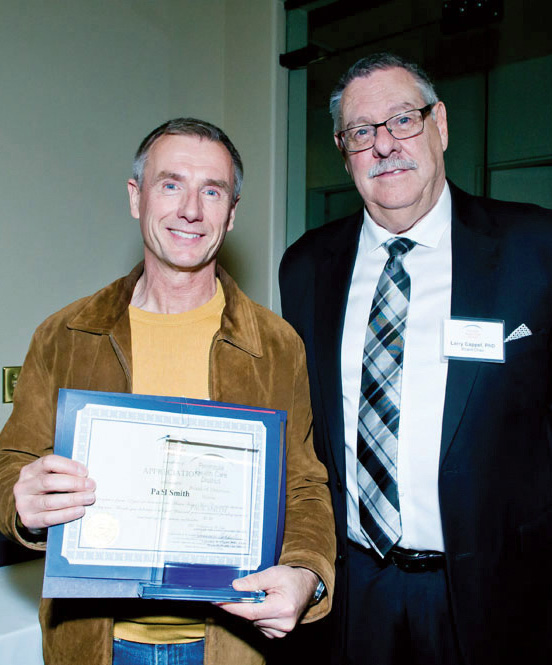 Volunteer Paul Smith receives award from Peninsula Health Care District